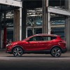 2021 Nissan Rogue Sport in red in a warehouse