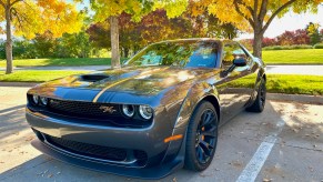 A front corner view of the 2022 Dodge Challenger R/T Scat Pack in front of trees.