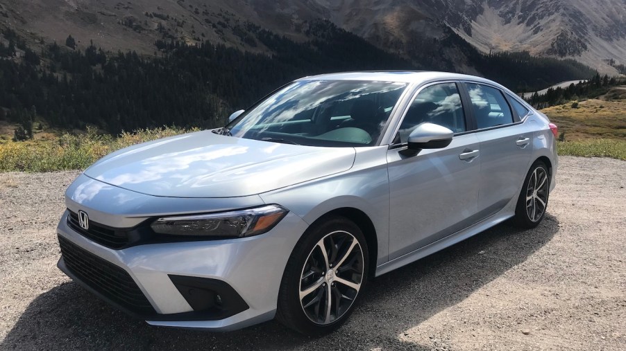 The 2022 Honda Civic parked by a mountain.