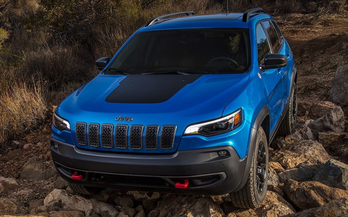 Blue 2022 Jeep Cherokee Trailhawk Crawling on Rocks