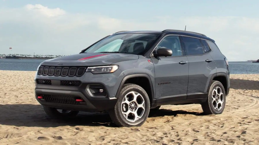2022 Jeep Compas parked on the beach. It's one of the best SUV deals of October 2022.