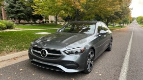 A front view of the 2022 Mercedes-Benz C-Class near a tree
