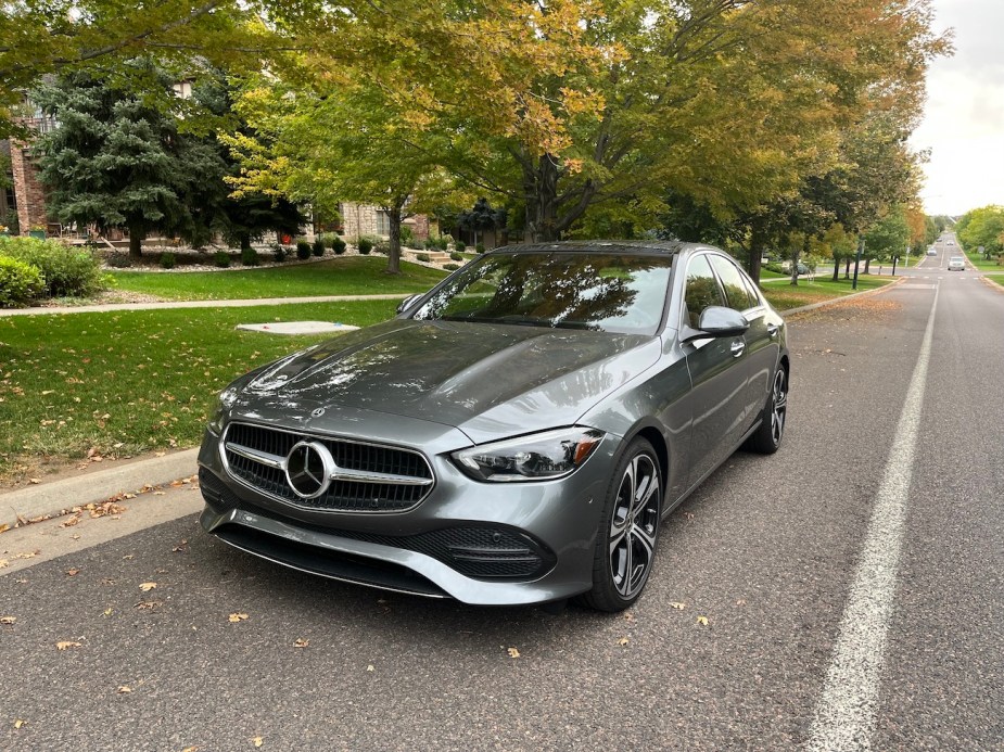 A front view of the 2022 Mercedes-Benz C-Class near a tree