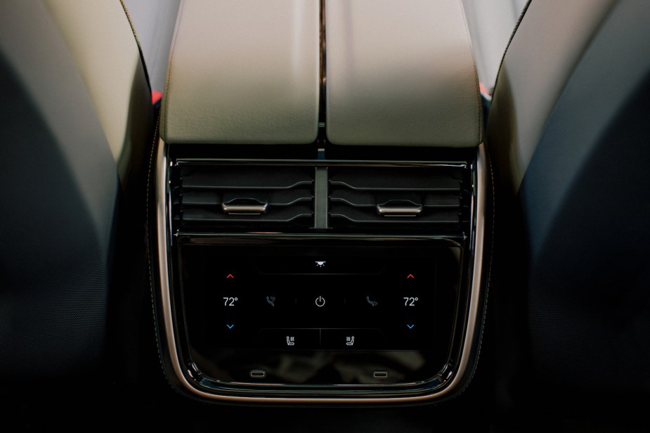 Closeup of the center console of the Rivian R1T with power outlets visible.