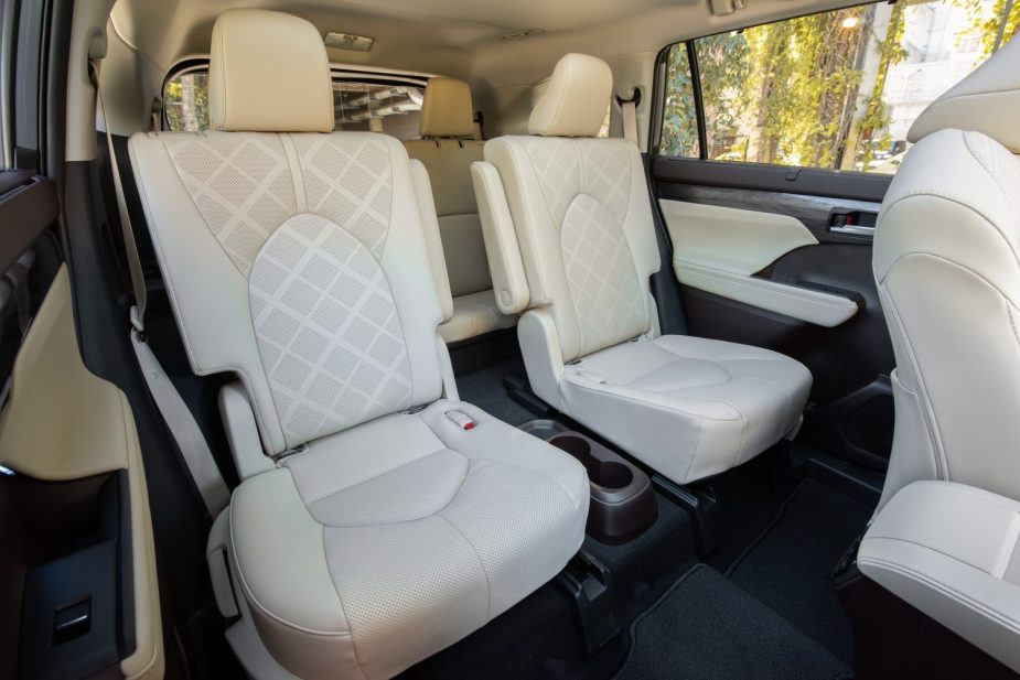 White leather seats in a Toyota Highlander crossover SUV's spacious interior, the same size as a Sequoia.