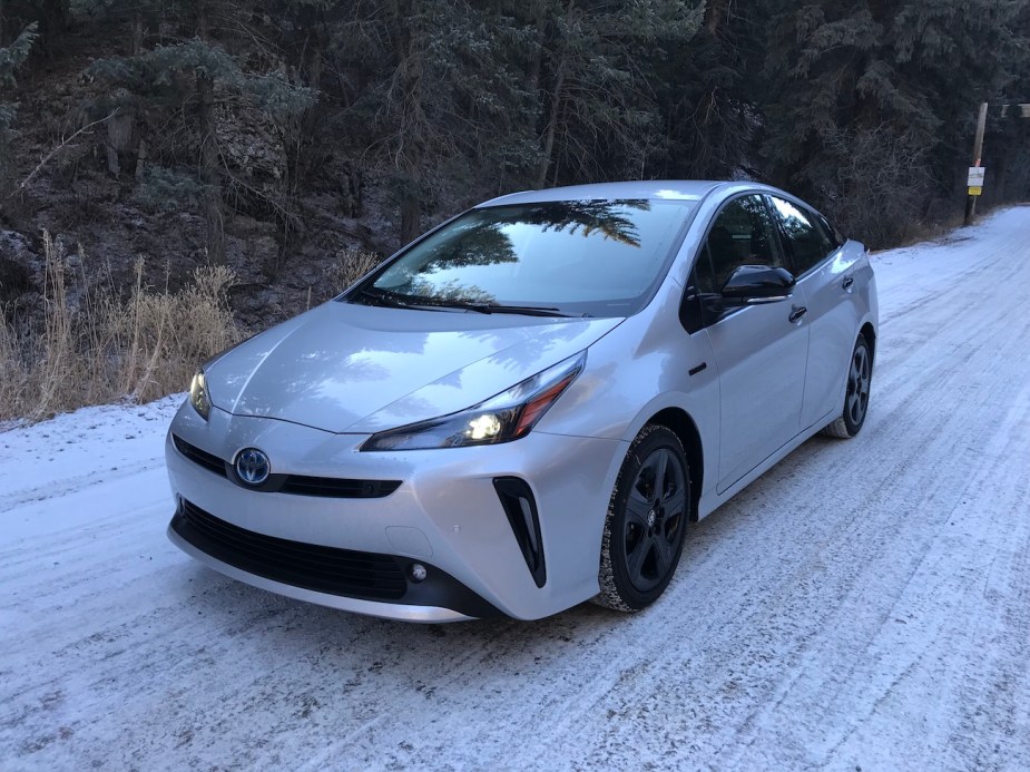 The 2022 Toyota Prius parked on a snowy road.