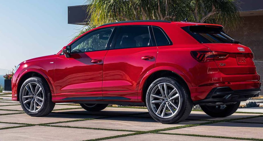 A red 2023 Audi Q4 subcompact SUV is parked. 