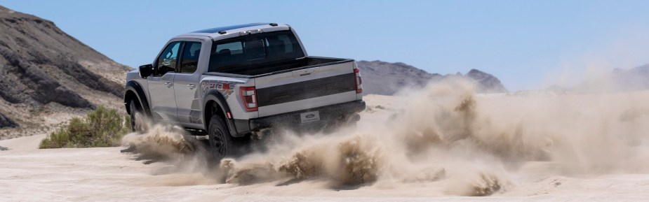 2023 Ford Raptor R kicking up a lot of sand in the desert. 