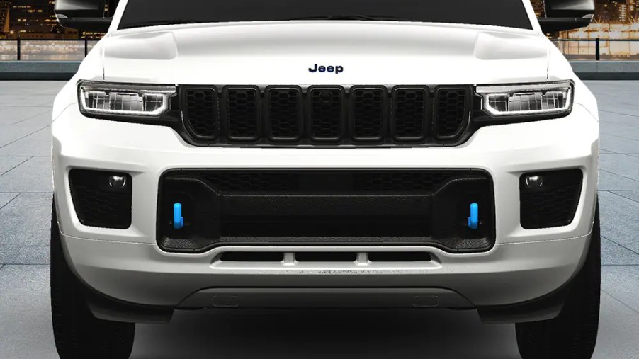A white 2023 Jeep Grand Cherokee 4xe30th Anniversary Edition is shown in direct front view