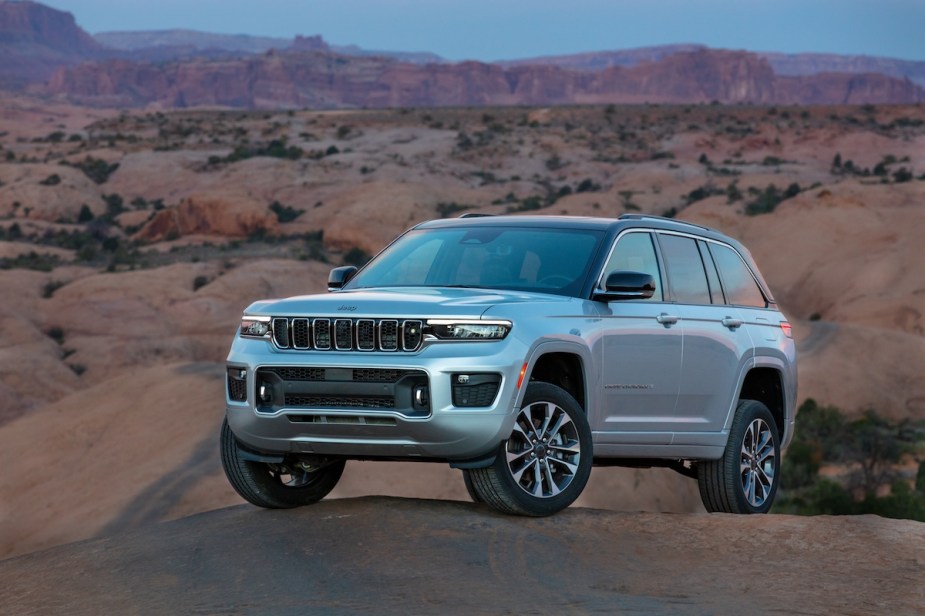 Silver 2023 Jeep Grand Cherokee 4xe in the desert.