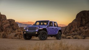 2023 Jeep Wrangler Unlimited SUV in the all-new purple reign color, parked in the desert.