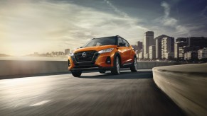 2023 Nissan Kicks in orange on a street