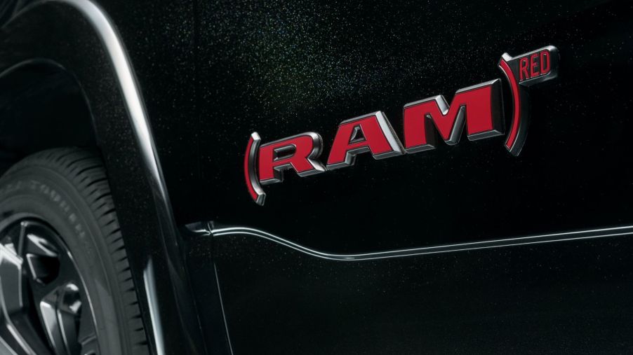 (RAM)RED special edition badging on a black 2023 Ram 1500 full-size pickup truck