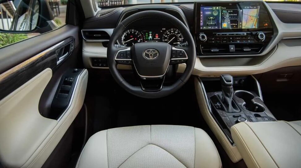 The interior of the Toyota Highlander in tan and black. 