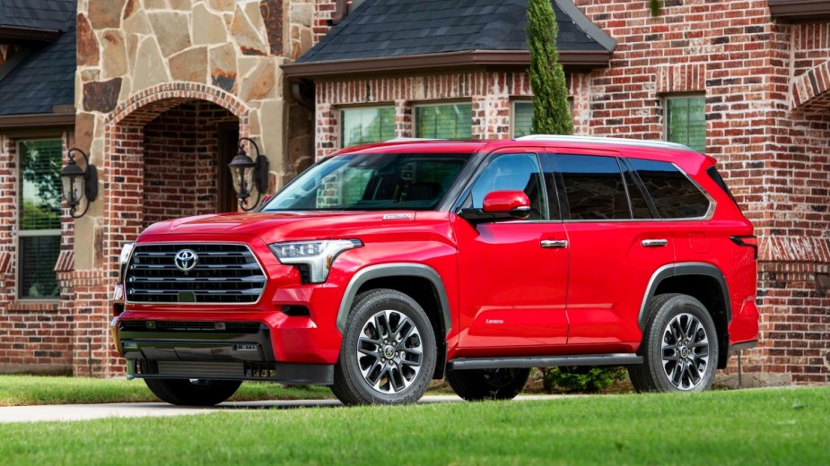 Red 2023 Toyota Sequoia Limited Full-Size SUV parked in front of a house