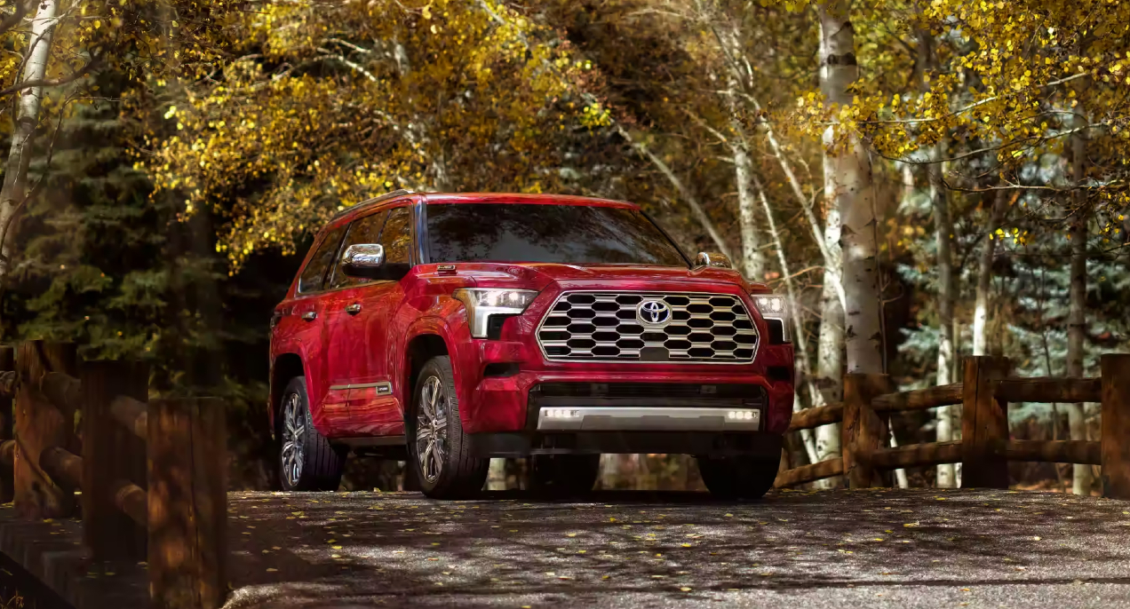 A red 2023 Toyota Sequoia full-size SUV is parked outdoors.