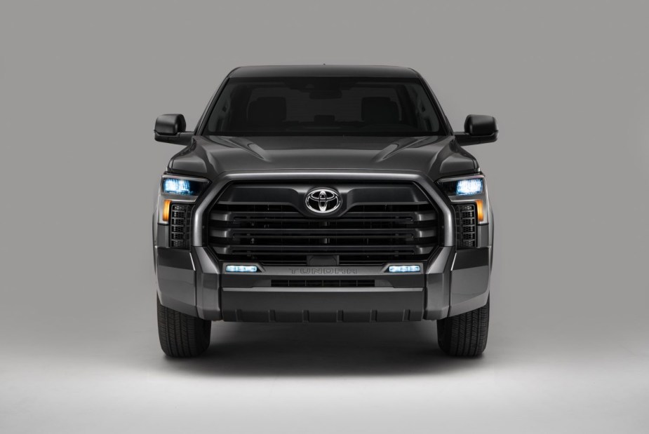 Head-on photo of the 2023 Toyota Tundra SR5 SX Packages blacked-out grille and trim, on a gray background.