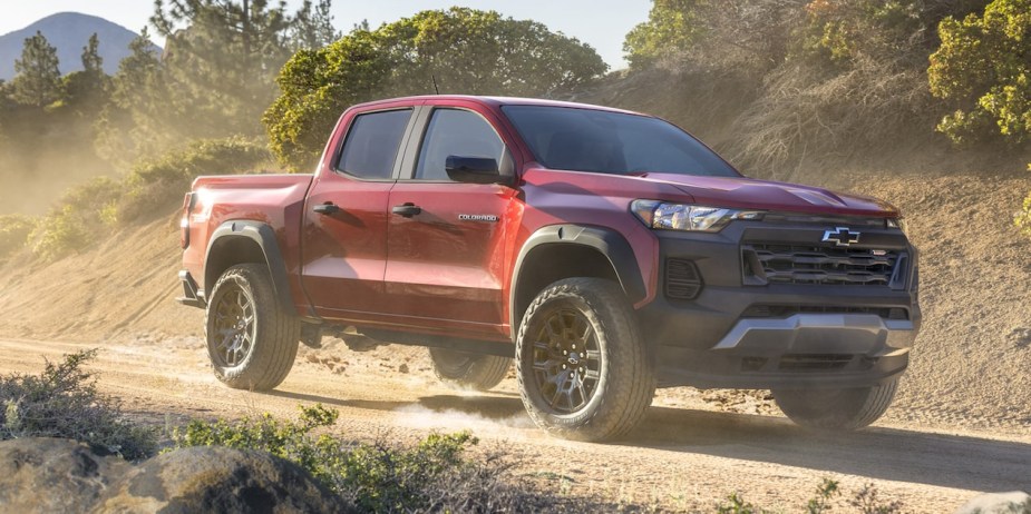 The new Trail Boss trim for the 2023 Chevy Colorado drives on a dirt road.