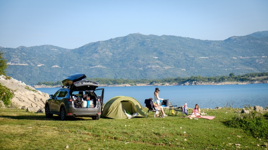 A Family Car Camping Next to a Lake
