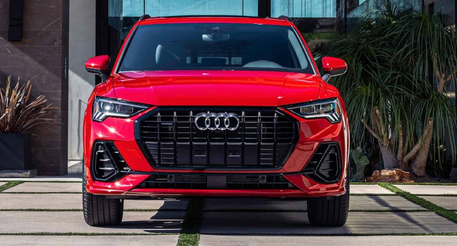 A red 2023 Audi Q3 subcompact SUV is parked. 