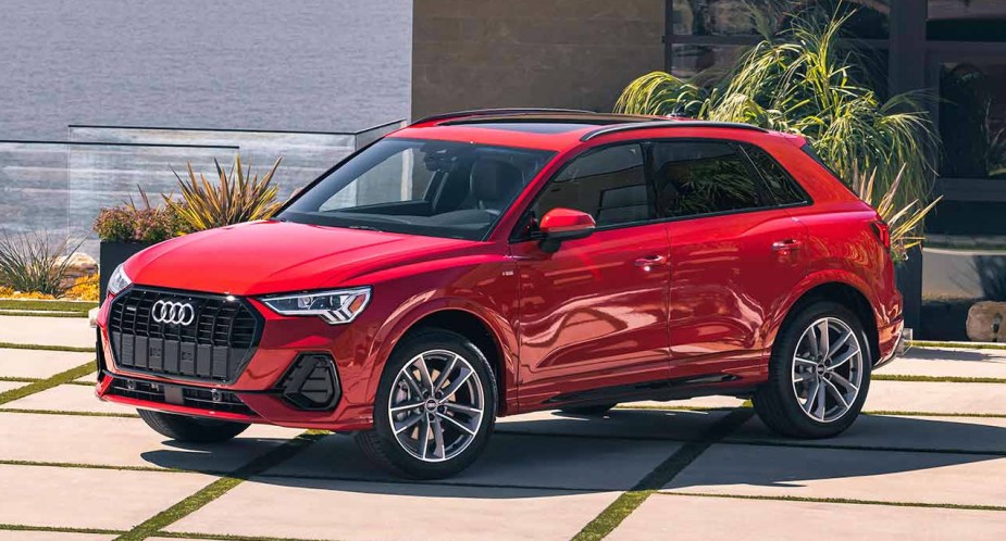 A red 2023 Audi Q3 subcompact SUV is parked. 