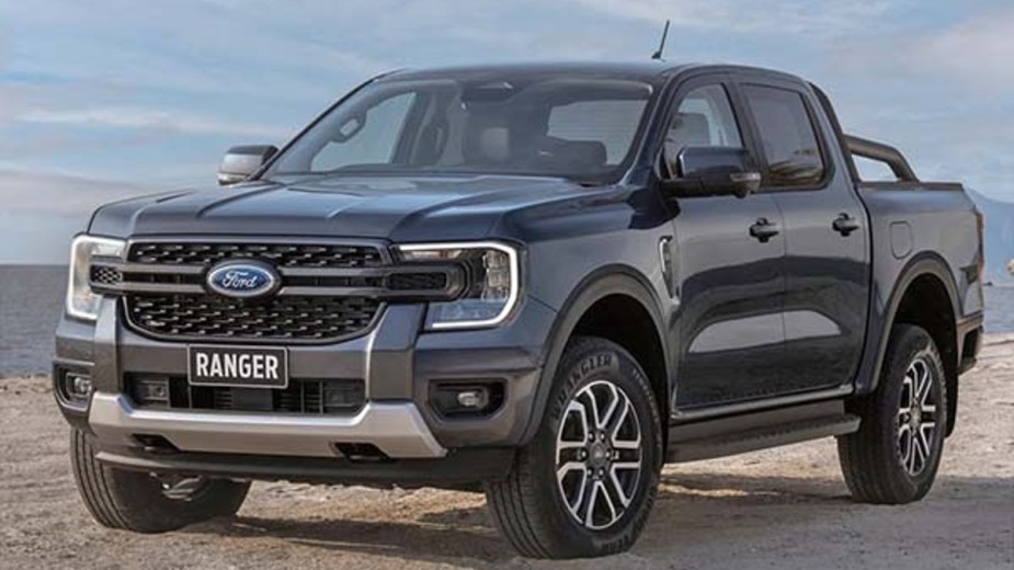 A black 2023 Ford Ranger posed on a dirt trail