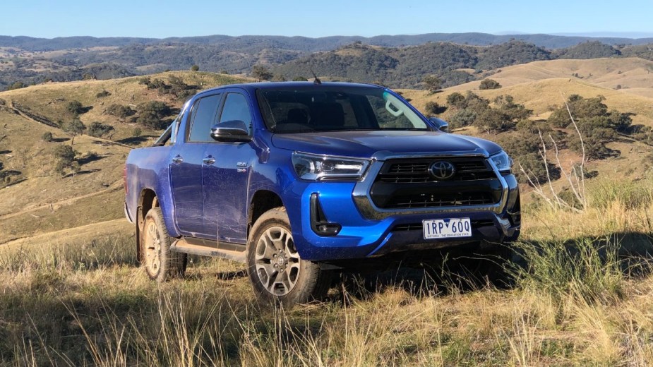 Blue 2023 Toyota Hilux in the wilderness