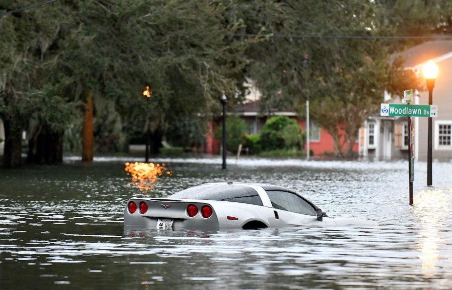 A car sits in floodwater after Hurricane Ian.