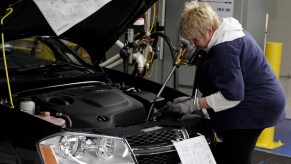 Filling up a car with transmission fluid that could potentially have a transmission fluid leak.
