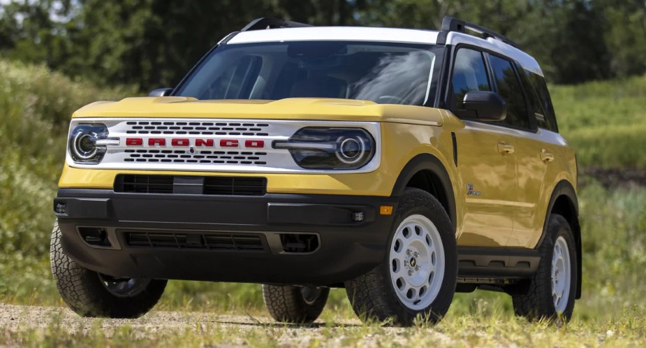 A yellow 2023 Ford Bronco Sport Heritage Edition is parked outdoors. 