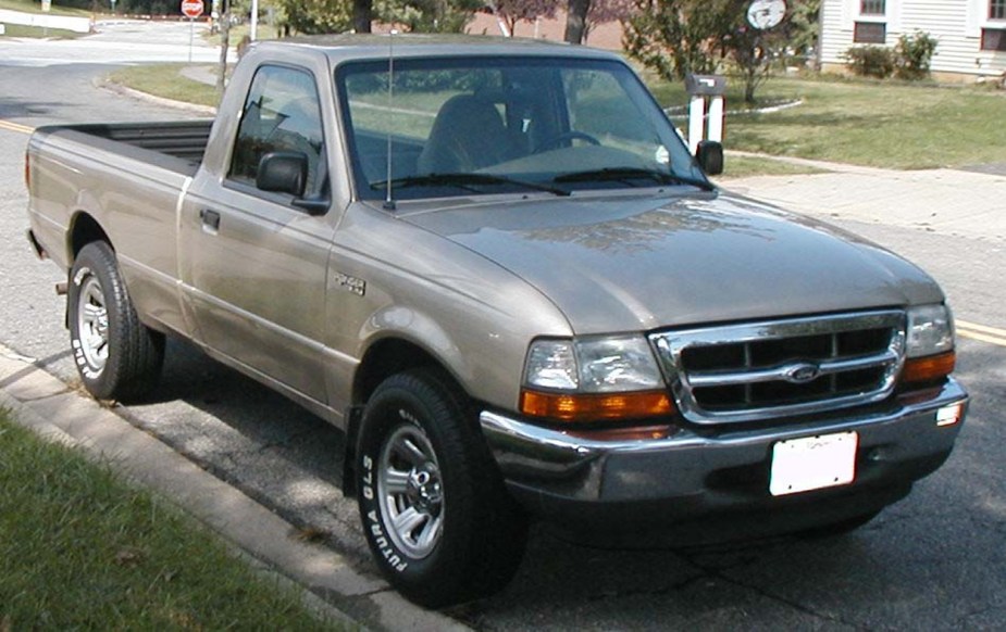 A 1999 Ford Ranger is parked.  It might not be a reliable midsize truck.