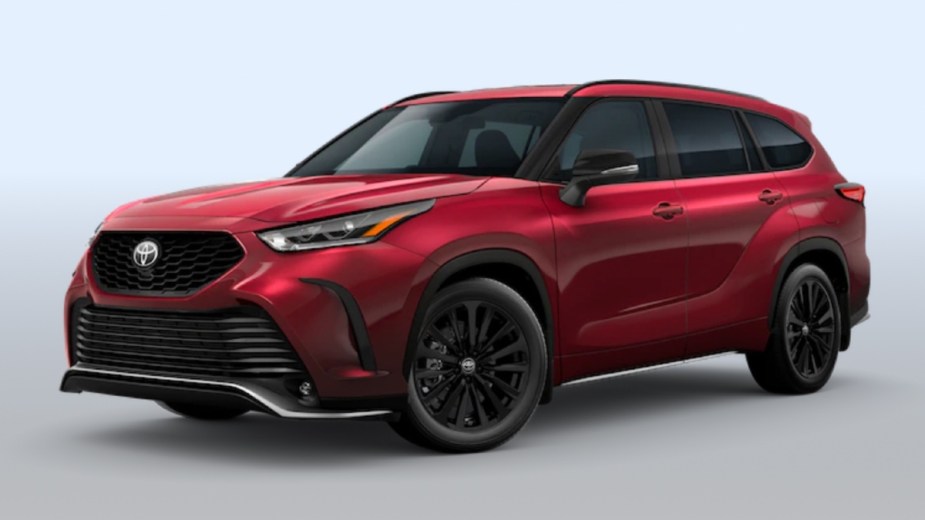 Front angle view of new 2023 Toyota Highlander midsize SUV with Ruby Flare Pearl exterior paint color