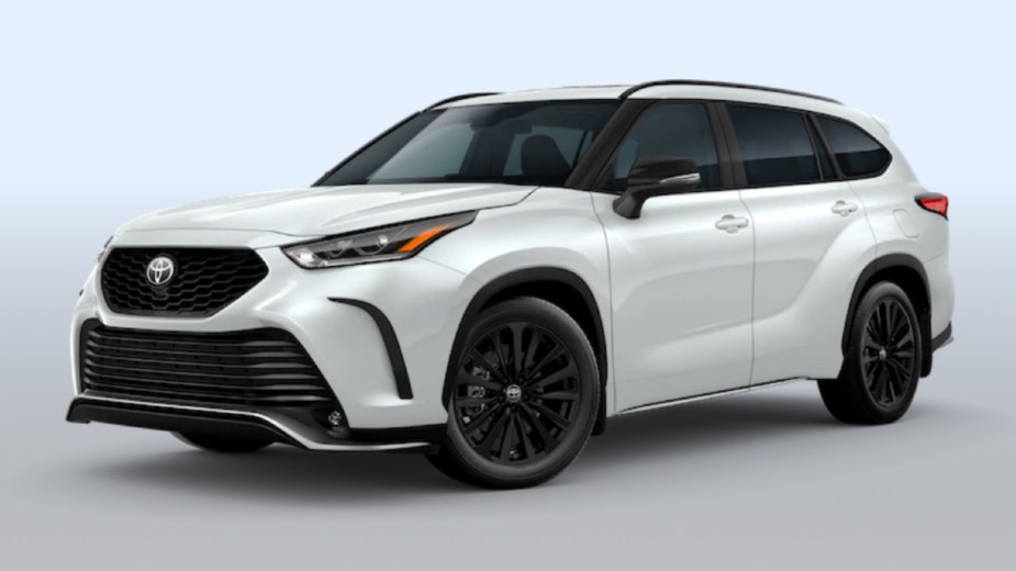 Front angle view of new 2023 Toyota Highlander midsize SUV with Wind Chill Pearl exterior paint color