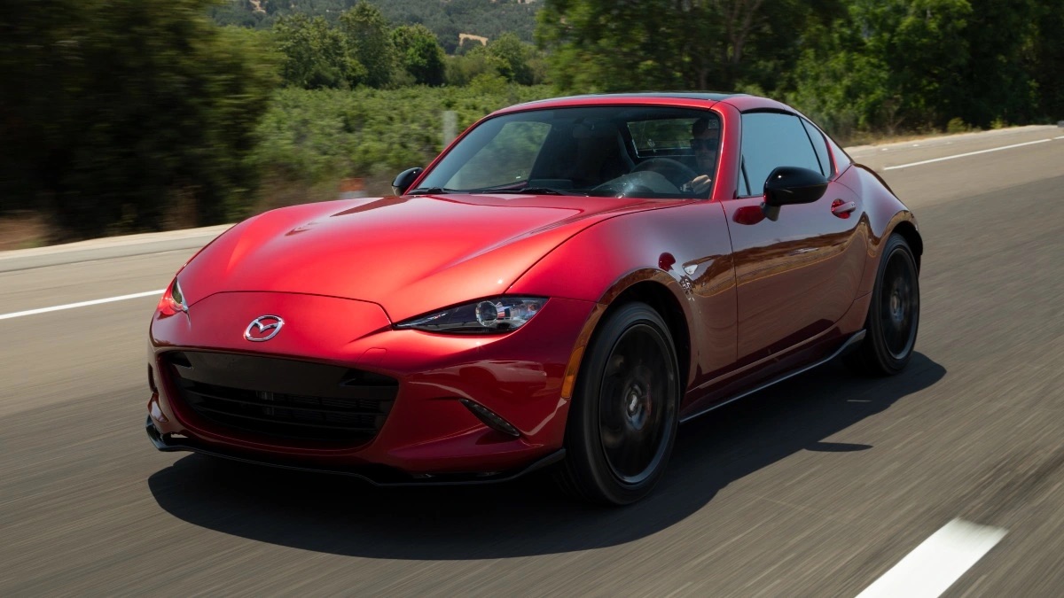 Front angle view of red 2022 Mazda MX-5 Miata, affordable sports car with high gas mileage