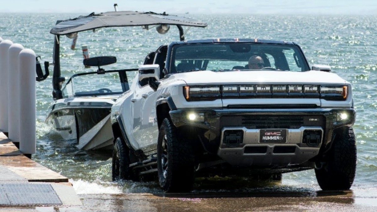 GMC Hummer EV Towing a Boat and putting it in the water