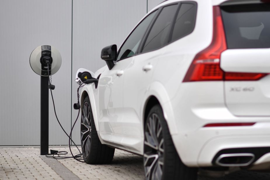 A Volvo XC60 hybrid SUV attached to a charger