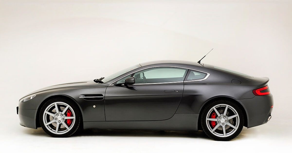 A 2014 Aston Martin V8 Vantage shows off its GT car side profile. 