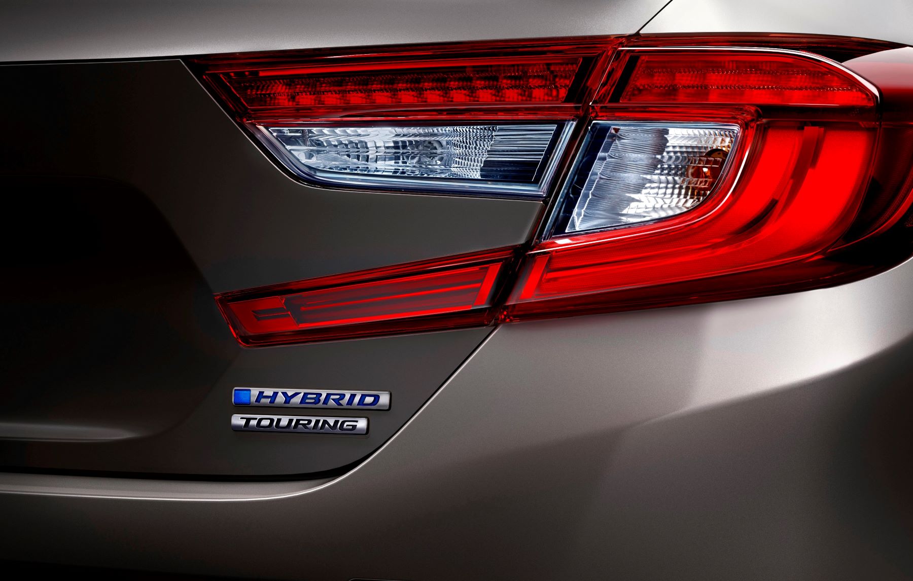 The rear badging on the trunk of a Honda Accord Hybrid Touring midsize sedan model