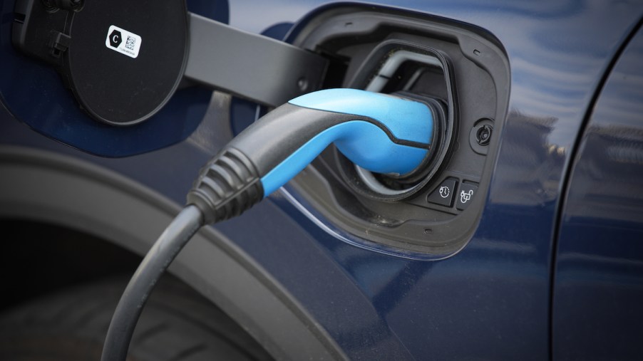 An EV charger plugged in that possible took advantage of the tax credit for EV chargers.