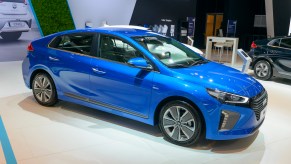 A blue Hyundai Ioniq plug-in hybrid (PHEV) parked indoors.