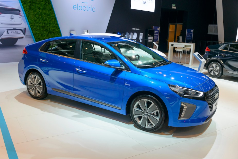 A blue Hyundai Ioniq plug-in hybrid (PHEV) parked indoors. 