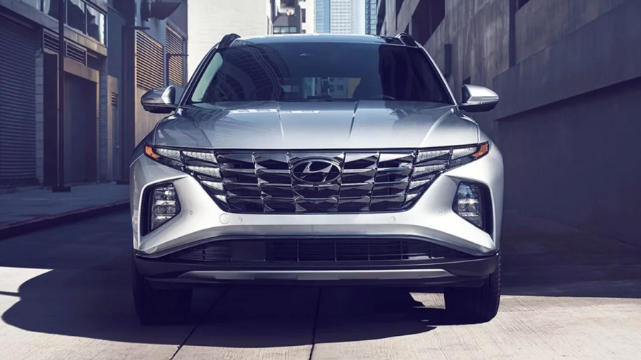A gray 2023 Hyundai Tucson small SUV is parked.