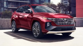 A red 2022 Hyundai Tucson is parked.