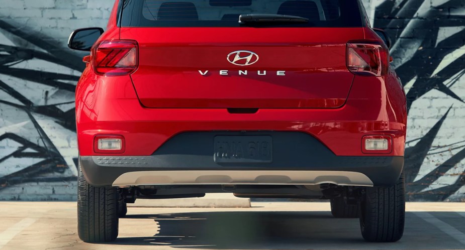 A red 2022 Hyundai Venue subcompact SUV is parked. 