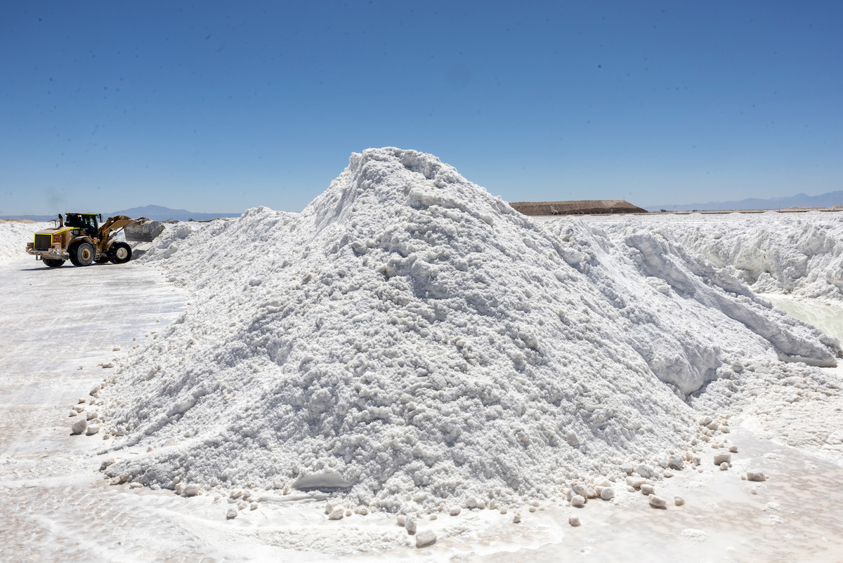 An All-Electric lithium mine with a pile of lithium.