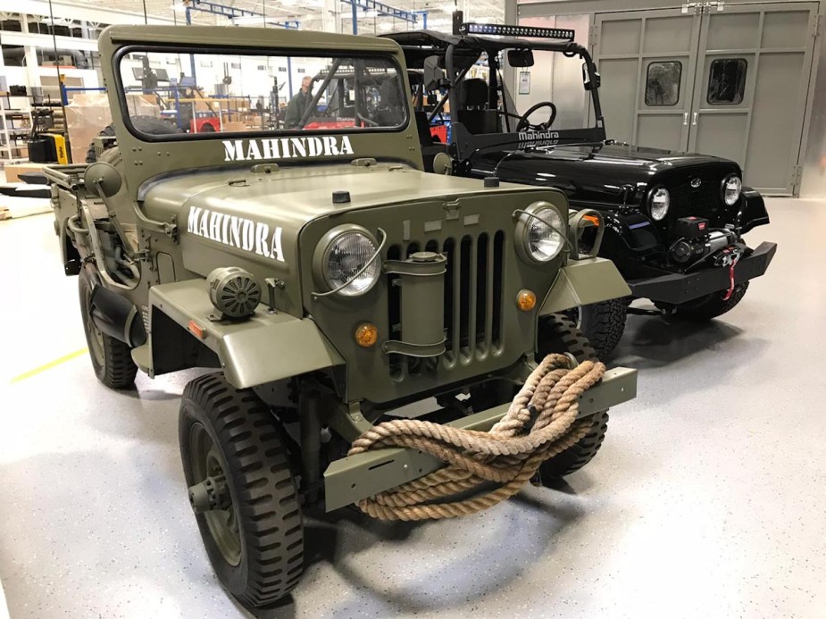 Promo photo of two Roxor side-by-sides built by Mahindra to look like Willys Jeeps from WWII.