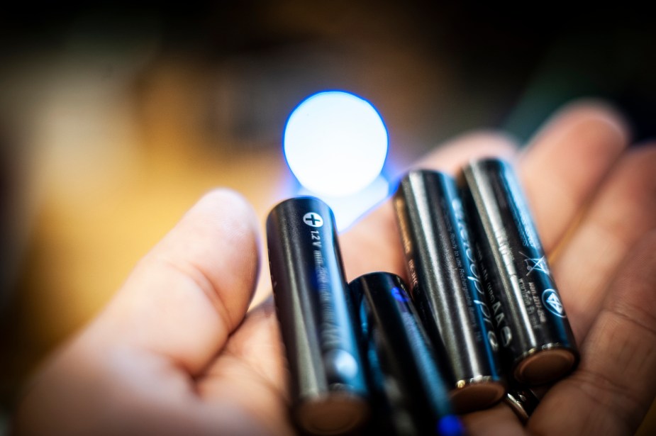 A handful of rechargeable nickel metal hydride (NiMH) batteries the same size as disposable AA alkaline batteries. 