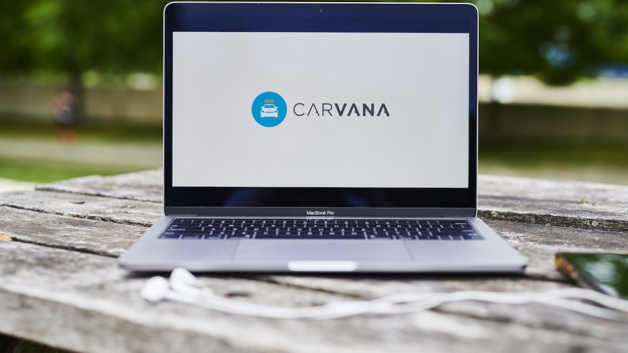 Carvana logo on a laptop where you can purchase a car online.