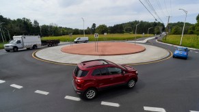 A roundabout with cars on it.