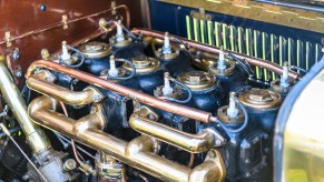 Spark plugs in an older engine.